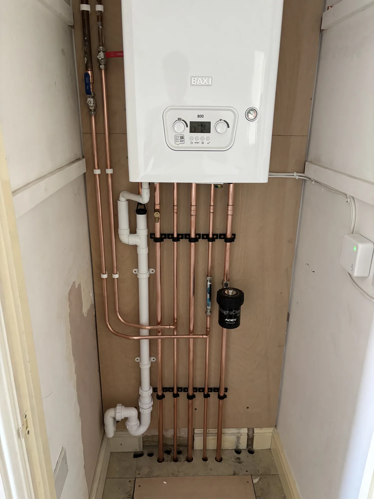 Boiler upgrade with neat copper pipe runs and a clean finish in a Suffolk home